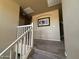 Upstairs hallway with carpeted floor and artwork at 44152 W Pioneer Rd, Maricopa, AZ 85139