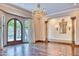 Elegant dining room with hardwood floors, chandelier, and French doors at 4529 E Clearwater Pkwy, Paradise Valley, AZ 85253