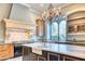 Luxury kitchen with marble countertops and a farmhouse sink at 4529 E Clearwater Pkwy, Paradise Valley, AZ 85253