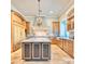 Island kitchen with marble countertops and wood cabinets at 4529 E Clearwater Pkwy, Paradise Valley, AZ 85253