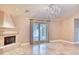 Bright living room with fireplace and sliding glass doors at 4529 E Clearwater Pkwy, Paradise Valley, AZ 85253