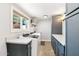 Bright laundry room with modern cabinetry and stone countertops at 4591 E Calle Ventura --, Phoenix, AZ 85018