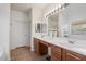 Double vanity bathroom with a large mirror and plenty of counter space at 46108 W Tulip Ln, Maricopa, AZ 85139