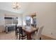 Dining area with a table for four and access to the backyard at 46108 W Tulip Ln, Maricopa, AZ 85139