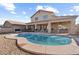 Large kidney shaped pool with patio and backyard at 46108 W Tulip Ln, Maricopa, AZ 85139