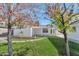 Landscaped backyard with trees, stone pathway, and grassy area at 4642 N 31St St, Phoenix, AZ 85016