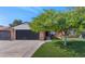 Brick home with a 2-car garage and a well-manicured lawn at 4642 N 31St St, Phoenix, AZ 85016