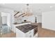 Modern kitchen with island, white cabinets, and black countertops at 4642 N 31St St, Phoenix, AZ 85016