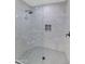 Large walk-in shower with tiled walls and corner seat at 4642 N 31St St, Phoenix, AZ 85016