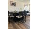 Dining area with a dark wood table and seating for six at 50134 W Gail Ln, Maricopa, AZ 85139