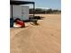 View of storage shed, trailer, and wheelbarrow at 50134 W Gail Ln, Maricopa, AZ 85139