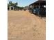 View of the property with covered parking and storage shed at 50134 W Gail Ln, Maricopa, AZ 85139