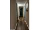 Hallway with dark wood flooring and teal doors at 50134 W Gail Ln, Maricopa, AZ 85139