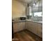 Modern kitchen with light cabinets and stainless steel sink at 50134 W Gail Ln, Maricopa, AZ 85139