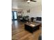 Spacious living room with dark wood coffee table and gray sofa at 50134 W Gail Ln, Maricopa, AZ 85139