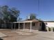 Backyard view of house with carport and storage at 5031 W Flynn Ln, Glendale, AZ 85301