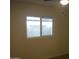 Bright bedroom with window and ceiling fan at 5031 W Flynn Ln, Glendale, AZ 85301