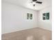 Bright bedroom with tile floors and double closets at 5031 W Flynn Ln, Glendale, AZ 85301