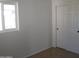 Simple bedroom with window, closet, and tile floors at 5031 W Flynn Ln, Glendale, AZ 85301