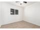 Simple bedroom with tile floors and a window at 5031 W Flynn Ln, Glendale, AZ 85301