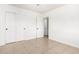 Simple bedroom with tile floors and double door closet at 5031 W Flynn Ln, Glendale, AZ 85301