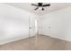 Well-lit bedroom featuring tile floors and multiple doors at 5031 W Flynn Ln, Glendale, AZ 85301