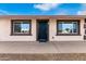 House exterior with a black front door at 5031 W Flynn Ln, Glendale, AZ 85301