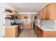 Modern kitchen with light wood cabinets, stainless steel appliances, and quartz countertops at 5031 W Flynn Ln, Glendale, AZ 85301