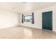 Empty living room with tile floors and a view of the street at 5031 W Flynn Ln, Glendale, AZ 85301