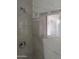 Clean shower with marble-look tile and modern fixtures at 5031 W Flynn Ln, Glendale, AZ 85301