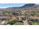 Aerial view of a luxurious house with a pool and mountain backdrop at 5989 E Sapphire Ln, Paradise Valley, AZ 85253