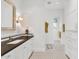 Modern bathroom with dark countertop and white cabinetry at 5989 E Sapphire Ln, Paradise Valley, AZ 85253