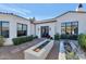 Charming courtyard entry with gravel, planters, and a walkway to the front door at 5989 E Sapphire Ln, Paradise Valley, AZ 85253