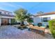 Charming brick courtyard with seating area and lush landscaping at 5989 E Sapphire Ln, Paradise Valley, AZ 85253