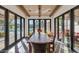 Elegant dining room with a rustic wooden table and access to the backyard patio at 5989 E Sapphire Ln, Paradise Valley, AZ 85253