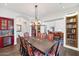 Formal dining room with a large table and built-in cabinetry at 5989 E Sapphire Ln, Paradise Valley, AZ 85253