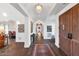 Bright entry hall with hardwood floors, high ceilings, and a view into the living area at 5989 E Sapphire Ln, Paradise Valley, AZ 85253