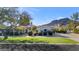 Beautiful Spanish-style home with a large lawn and mountain backdrop at 5989 E Sapphire Ln, Paradise Valley, AZ 85253