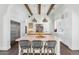 Modern kitchen with white cabinetry, stainless steel appliances, and a large island at 5989 E Sapphire Ln, Paradise Valley, AZ 85253