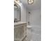 Bathroom boasts a decorative vanity, bathtub, and geometric floor tile at 6017 E Beck Ln, Scottsdale, AZ 85254