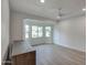 Bright bedroom with bay window, wood-look floors, and ceiling fan at 6017 E Beck Ln, Scottsdale, AZ 85254