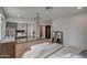 Bright bedroom with mirrored closet doors at 6017 E Beck Ln, Scottsdale, AZ 85254