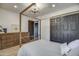 Bright bedroom with a canopy bed, dresser, and large closet at 6017 E Beck Ln, Scottsdale, AZ 85254