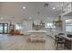 Modern kitchen with white cabinets, quartz countertops, and an island at 6017 E Beck Ln, Scottsdale, AZ 85254