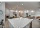 Open concept kitchen with expansive island and wine cooler at 6017 E Beck Ln, Scottsdale, AZ 85254