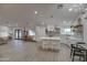 Modern kitchen with white cabinets, quartz countertops, and an island at 6017 E Beck Ln, Scottsdale, AZ 85254