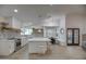 Modern kitchen with white cabinets, quartz countertops and breakfast nook at 6017 E Beck Ln, Scottsdale, AZ 85254