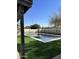 Inviting rectangular pool with artificial turf and a pergola at 6017 E Beck Ln, Scottsdale, AZ 85254