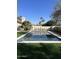 Sparkling clean rectangular pool surrounded by artificial turf at 6017 E Beck Ln, Scottsdale, AZ 85254