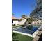 Modern rectangular pool with artificial turf and a clean design at 6017 E Beck Ln, Scottsdale, AZ 85254